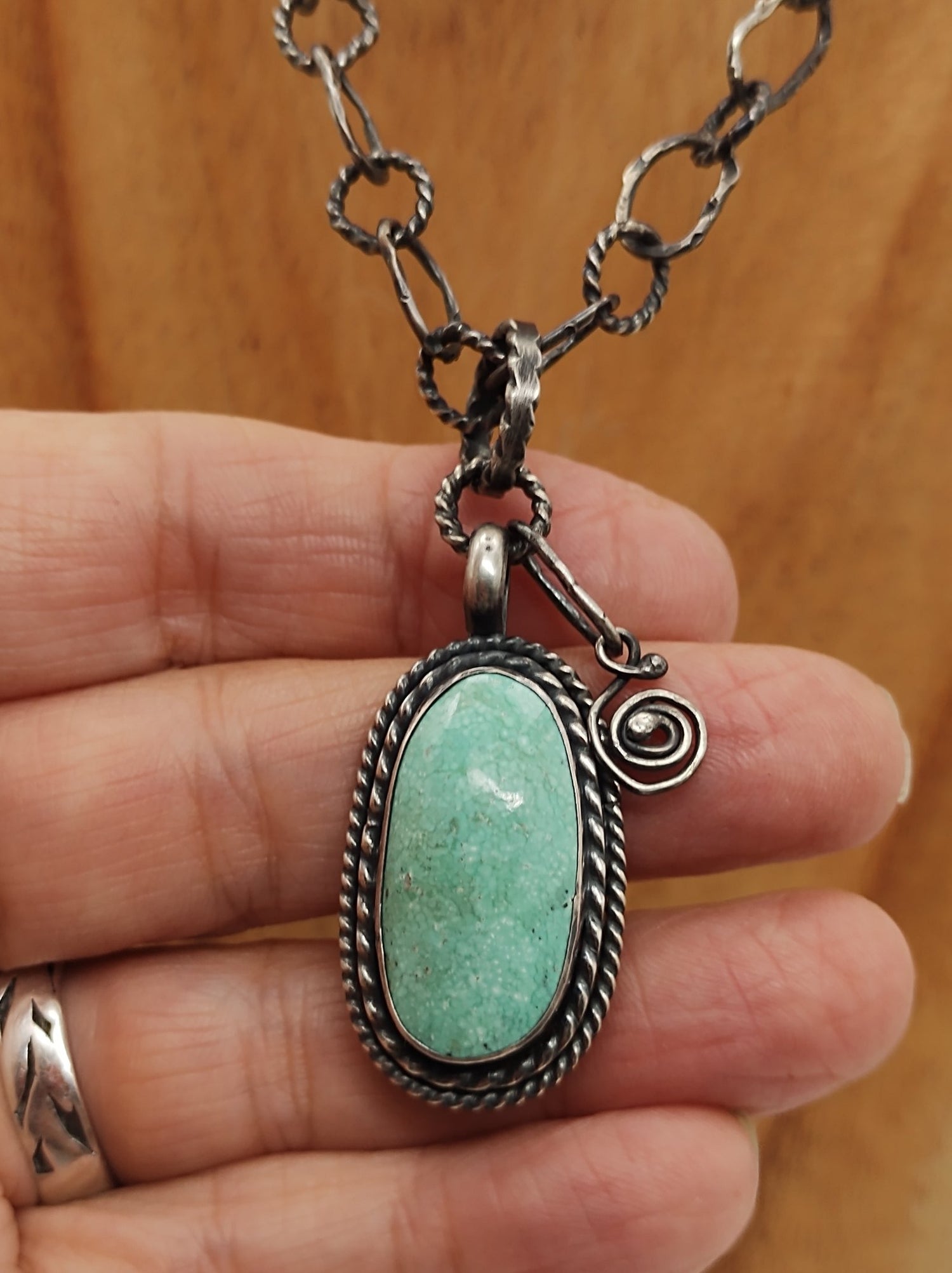 green turquoise with white webbing in silver with handmade chain