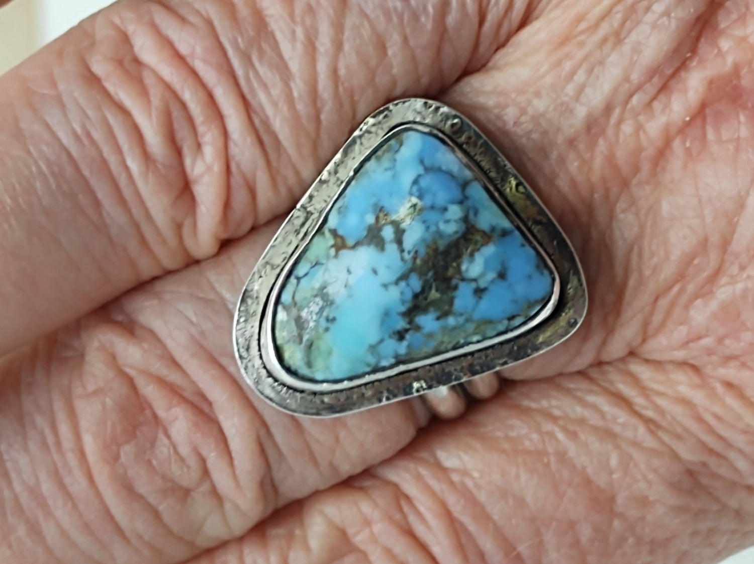 turquoise ring in sterling silver on finger